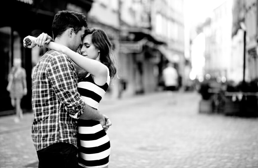 Young couple in love, hugging on the street, make your relationship last