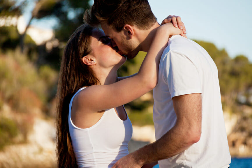attractive couple in love summertime on beach